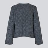 Loose knit with wide sleeves in cable knit. KurtisMD round neckline and rolled edges.