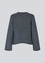 Loose knit with wide sleeves in cable knit. KurtisMD round neckline and rolled edges.