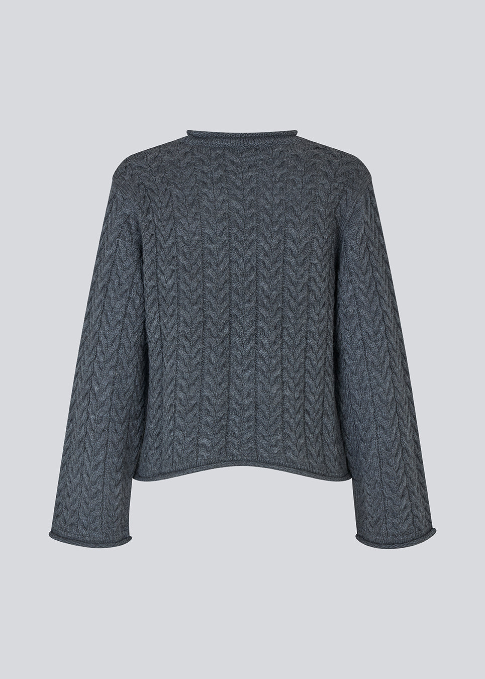 Loose knit with wide sleeves in cable knit. KurtisMD round neckline and rolled edges.
