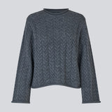 Loose knit with wide sleeves in cable knit. KurtisMD round neckline and rolled edges.