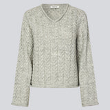 Loose grey wool knit with wide sleeves. KurtisMD v-neck has a v-neck and rolled edges.