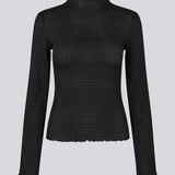 Longsleeved black top in an elastic and slighly see-through material. LaceyMD is fitted and has a high neck.