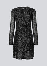 Black short dress with sequins. LaraMD dress has a slim silhouette with a round neck and longsleeves, along with a keyhole opening at the back with a button closure.
