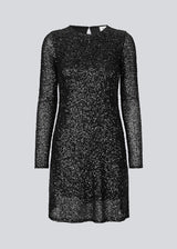 Black short dress with sequins. LaraMD dress has a slim silhouette with a round neck and longsleeves, along with a keyhole opening at the back with a button closure.
