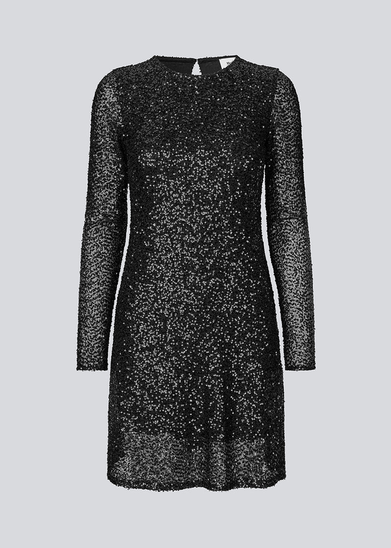Black short dress with sequins. LaraMD dress has a slim silhouette with a round neck and longsleeves, along with a keyhole opening at the back with a button closure.
