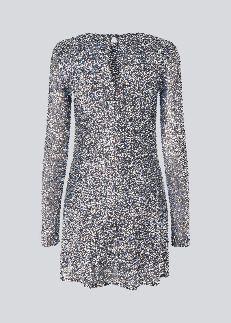 Short dress with silver sequins. LaraMD dress has a slim silhouette with a round neck and longsleeves, along with a keyhole opening at the back with a button closure.