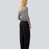 longsleeved top in silver sequence jersey. LaraMD top is fitted and has a round neck.
