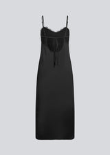 Long black dress in satin with a lace detail on the chest and an open back. LivMD dress is fitted, has thin adjustable straps and a slit in the side.