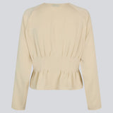 Fitted creme-colored top with boxpleats in satin. LivMD shirt has a button closure in front and loose sleeves.