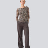 GwenMD top is a tight-fitted mesh top in leo print and gatherings in front. The top has a wide neckline and long sleeves, that are slightly more transparent than the body.&nbsp;
