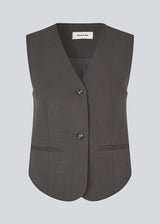 Fitted dark grey habit vest. LonnieMD vest has a V-neck, two pockets in front and a button closure.