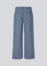 Loose pants in denim with a working inspired look. MagdalenaMD pants has a high waist, sidepockets and wide legs.