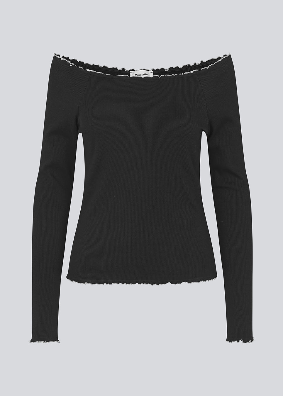 Off-shoulder long sleeve top in black with white edges . MagdaloneMD LS top is fitted and has babylock edges. The model is 177 cm and wears a size S/36.