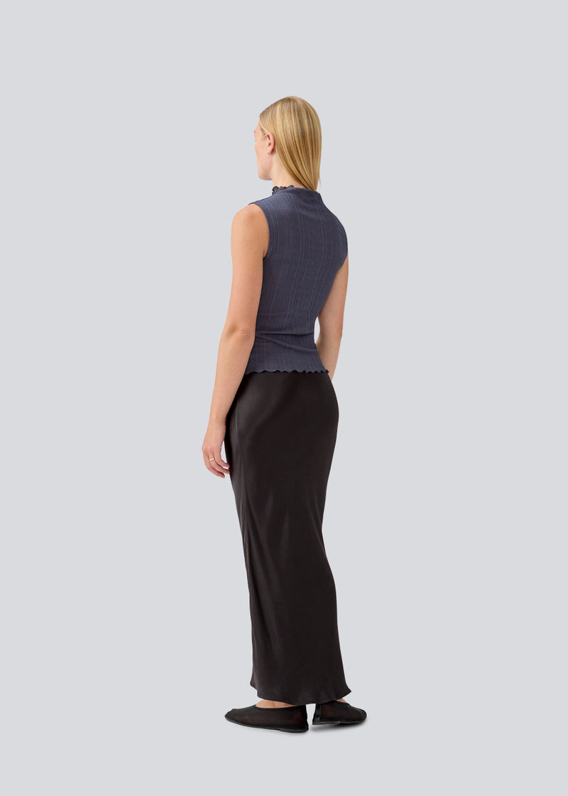 Maxi skirt in satin. MalkiMD skirt has an a-facon and an elastic in the waist. 