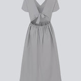 Long dress with short sleeves and a bow detail. MalleMD long dress is fitted with a loose skirt and has an invisible zipper in the side.