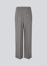 Suit pants with an asymmetrical closure detail. MalouMD pants has sidepocket, a high waist and wide legs.