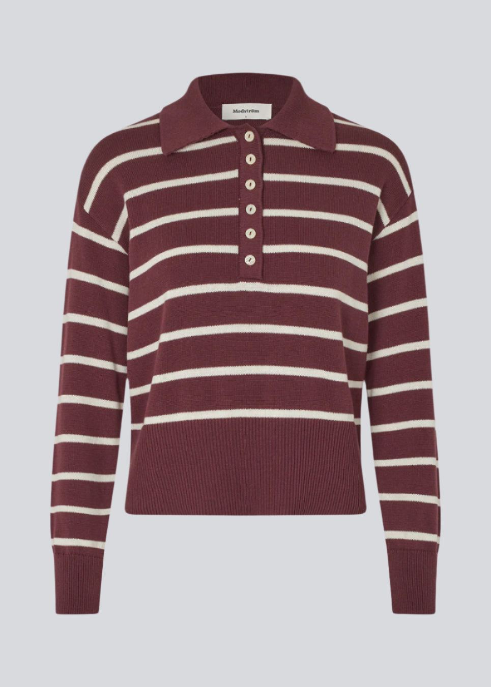 Soft knitted polo in plain jersey knit in burgundy/dark red with white stripes. MalvaMD stripe polo has a collar and a buttonclosure in front. The knit is small and slightly cropped.
