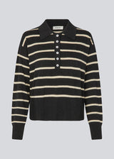 Soft knitted polo in black with white stripes in plain jersey knit. MalvaMD stripe polo has a collar and a button closure in front. The model is 177 cm and wears a size S/36.
The knit is small and slightly cropped.