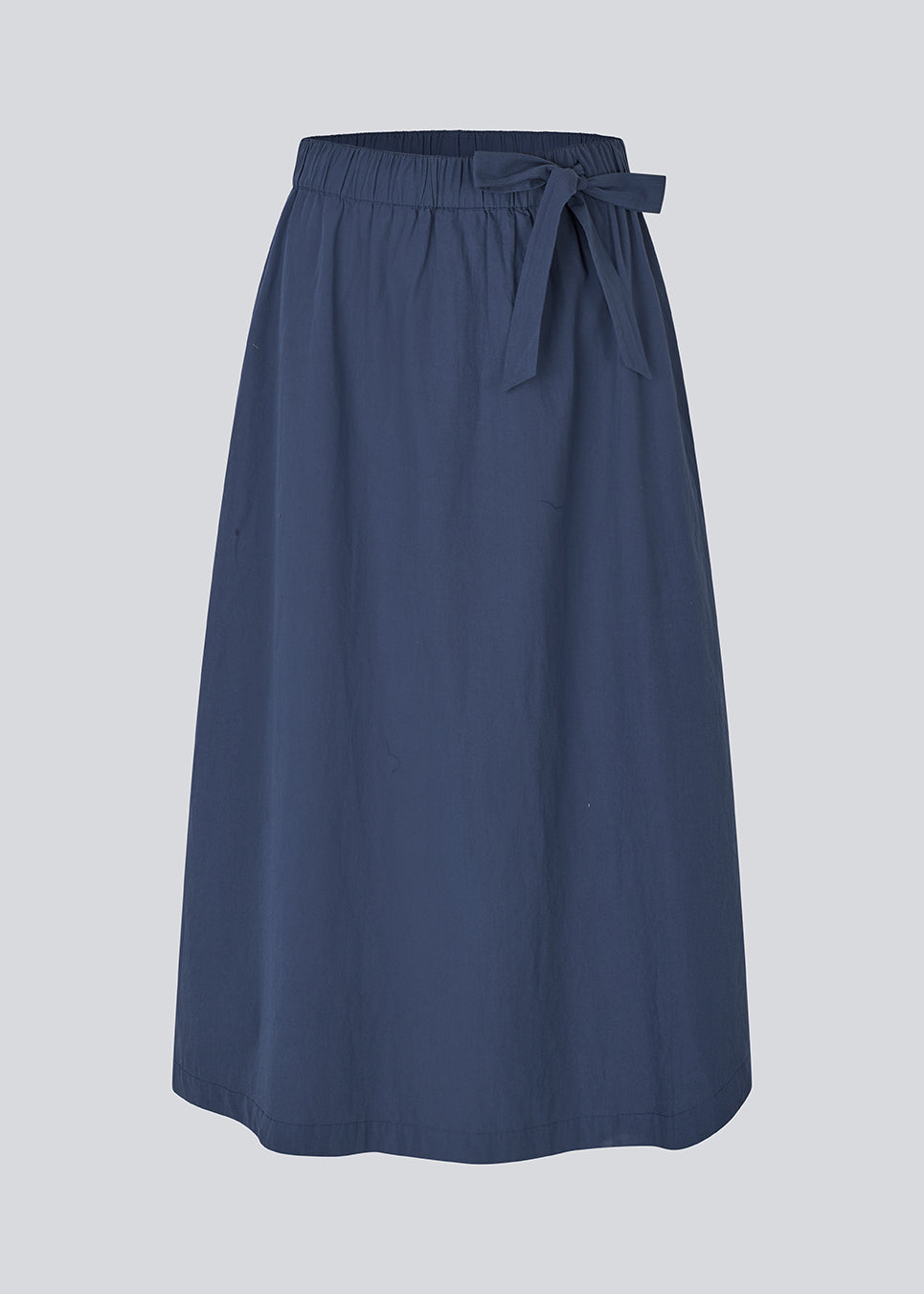 Midi skirt in 100% organic cotton. MaudeMD skirt has an a-facon and a elastic waist with a tieband. 