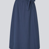 Midi skirt in 100% organic cotton. MaudeMD skirt has an a-facon and a elastic waist with a tieband. 