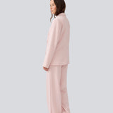 Suit pants with wide legs and an elastic waist. MaxwellMD pants has a medium-highwaist, zipper, side pockets and paspoil pocket in the back