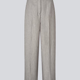 Suit pants with wide legs and pressfolds. MeridaMD pants has a medium-highwaist, zipper, side pockets and paspoil pocket in the back.