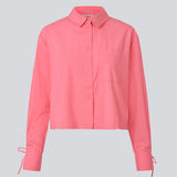 Cropped shirt in cotton with a loose fit. MeyrickMD shirt has wide sleeves, a cheast pocket and cuffs with a slit and a tieband.