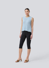 Crochet top in light blue without sleeves in organic cotton. MieMD top has detailed trimmings and a deep v-neckline in the back with a tieband closure. The model is 175 cm and wears a size S/36.