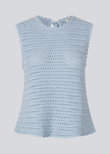 Crochet top in light blue without sleeves in organic cotton. MieMD top has detailed trimmings and a deep v-neckline in the back with a tieband closure. The model is 175 cm and wears a size S/36.