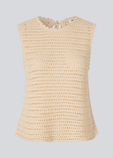 Crochet top in beige without sleeves in organic cotton. MieMD top has detailed trimmings and a deep v-neckline in the back with a tieband closure. The model is 175 cm and wears a size S/36.