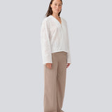 Loose shirt in broderie anglaise. MisoMD shirt has long wide sleeves and 2 buttons in front.