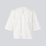 Top with short sleeves in broderie anglaise. MisoMD top has a loose fit and a slit with button closure at the back