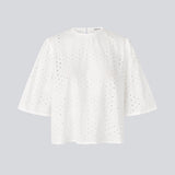 Top with short sleeves in broderie anglaise. MisoMD top has a loose fit and a slit with button closure at the back