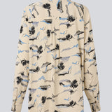 Classic shirt with a loose fit. MistMD print shirt has long sleeves, collar and a button closure in front.