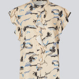 Sleeveless top with frill details. MistMD SS top has a loose fit and a button closure with frill details in front. 