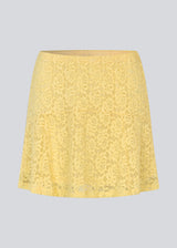 Short lace skirt in yellow wth an a-line. NamumdMD skirt has a lining and an elastic at the waist.