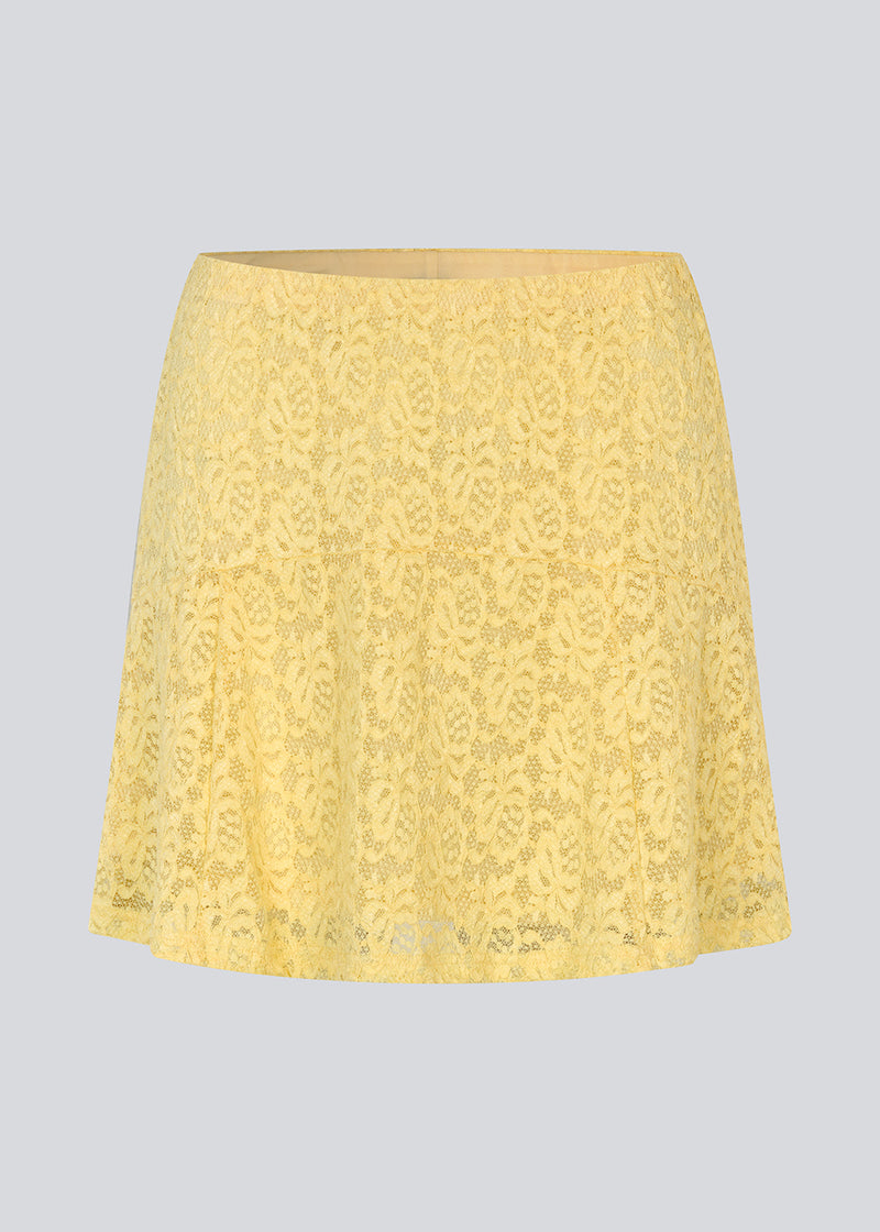 Short lace skirt in yellow wth an a-line. NamumdMD skirt has a lining and an elastic at the waist.