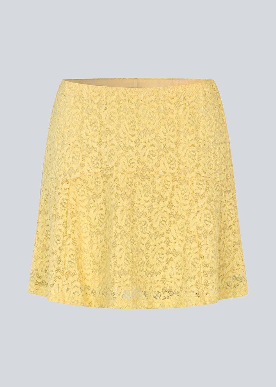 Short lace skirt in yellow wth an a-line. NamumdMD skirt has a lining and an elastic at the waist.
