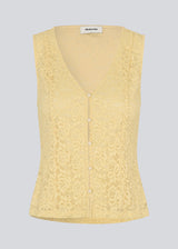 Sleeveless lace top in yellow with a v-neck. MamumdMD top is fitted and has a button closure in front.