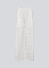 White pants with wide legs in broderie anglaise. NanetteMD pants have an elastic waistband and lining.