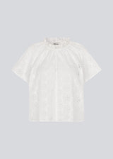 Top with short sleeves in broderie anglaise. NanetteMD SS top has a loose fit and an opening in front with a button closure.