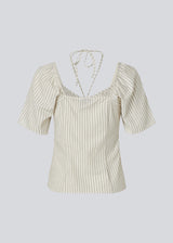 Short-sleeved top with tiedetails in 100% organic cotton. NanikaMD top has a tieband which wraps around the neck, an elastic silicone tape at the
