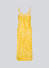 Maxi dress in yellow with thin straps and an elastic gathering at the chest. Napthalimd print strap dress has a slit in the front and an invisible zipper at the back.