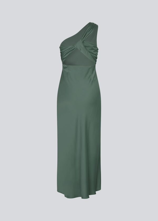 Long one shoulder dress in green in satin. NarcissaMD dress has an open back with beautiful details and an invisible zipper in the side.