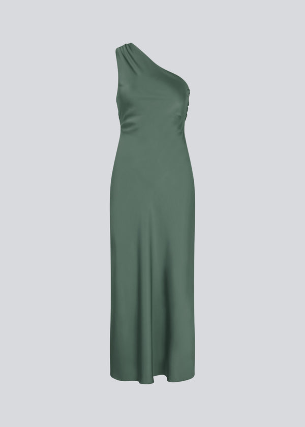 Long one shoulder dress in green in satin. NarcissaMD dress has an open back with beautiful details and an invisible zipper in the side.