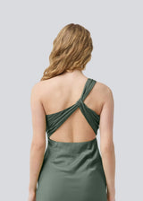Long one shoulder dress in green in satin. NarcissaMD dress has an open back with beautiful details and an invisible zipper in the side.
