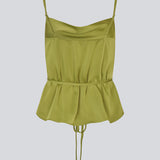 Loose top with thin adjustable straps in satin. NarcissaMD strap top has a thin tieband in the waist and a waterfall detail at front.