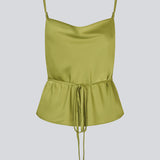 Loose top with thin adjustable straps in satin. NarcissaMD strap top has a thin tieband in the waist and a waterfall detail at front.