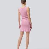 Short pink fitted dress in shimmery knit. NavalMD dress is sleeveless and has a round neckline.