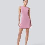 Short pink fitted dress in shimmery knit. NavalMD dress is sleeveless and has a round neckline.
